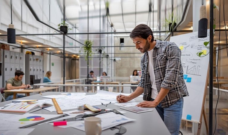 Creative business man working at a coworking space - stock photo