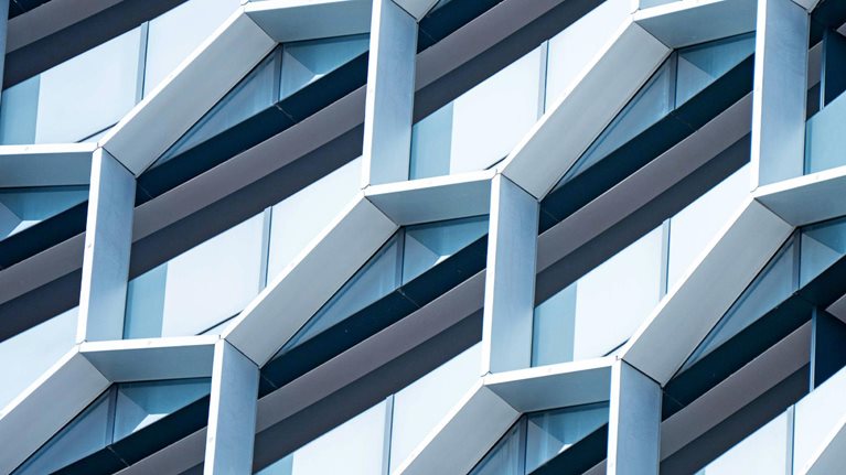 Detail of hexagon-shaped windows on a modern office building.
