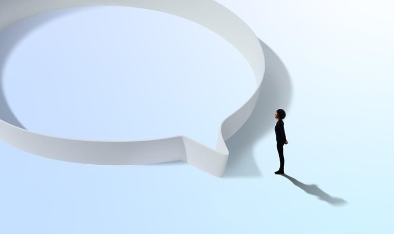 Woman in black standing near a circular hoop