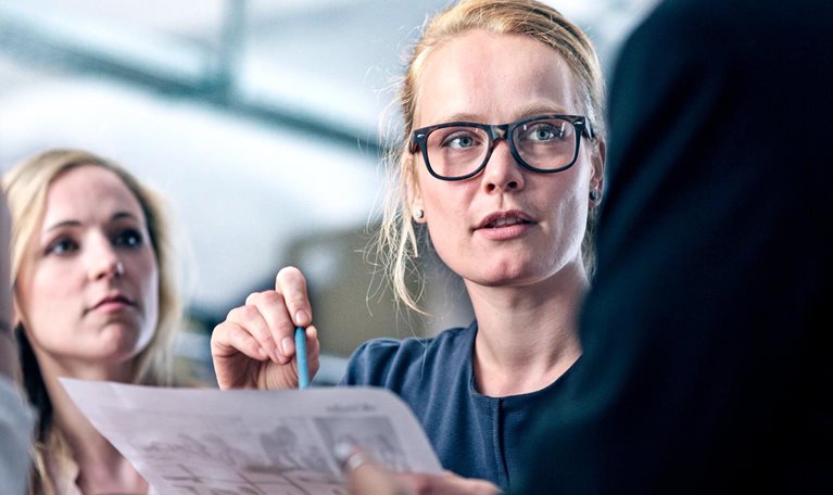 Women leading her team in business meeting