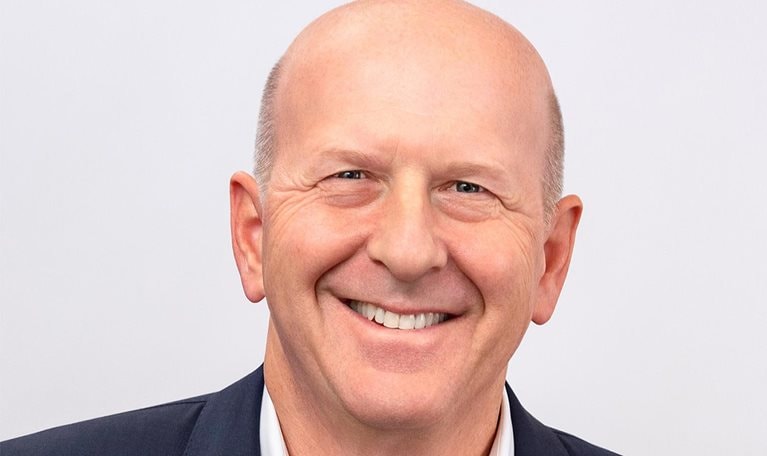 Smiling portrait of David Solomon, CEO at Goldman Sachs