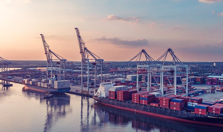 An aerial view of container ships in dock