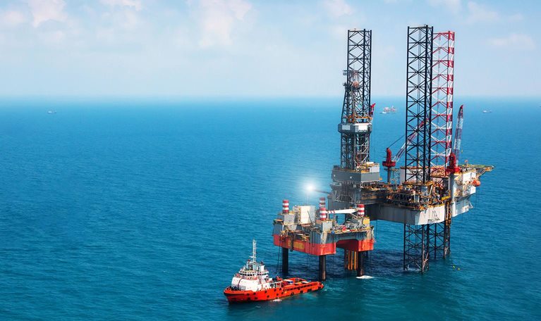 Oil platform in middle of ocean - stock photo