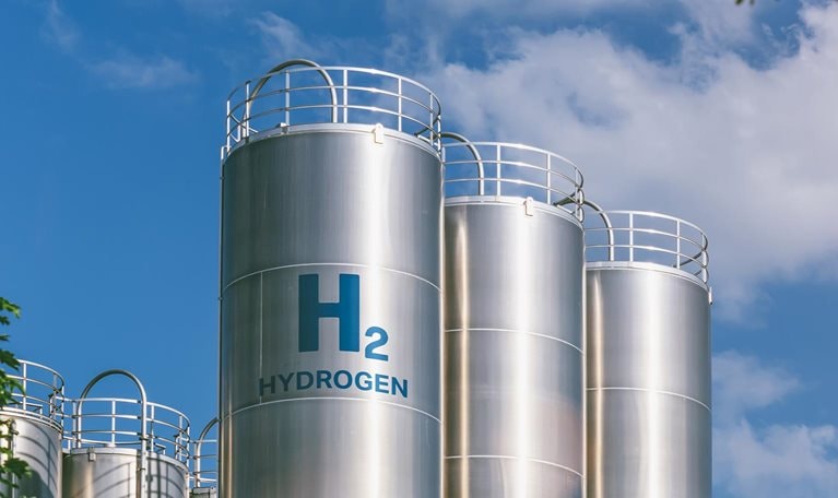 Hydrogen renewable energy production - hydrogen gas for clean electricity solar and windturbine facility - stock photo