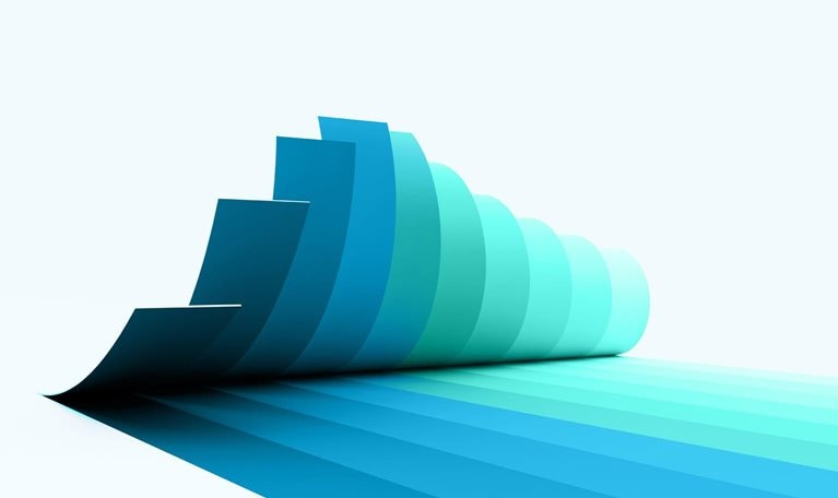 A series of overlapping, curved paper like sheets arranged in a cascading formation, transitioning in color from deep teal to light aqua. The shapes create a smooth gradient effect and cast elongated, layered shadows across a light gray background.