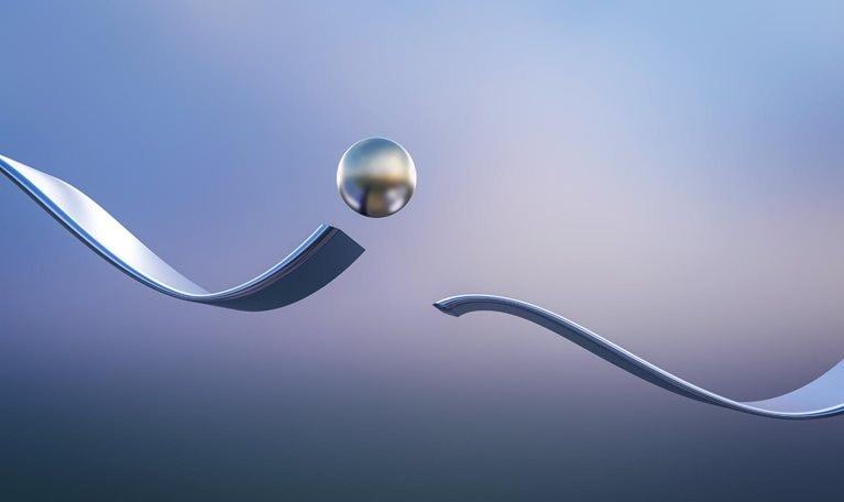 Metal ball jumping over interruption of wavy track