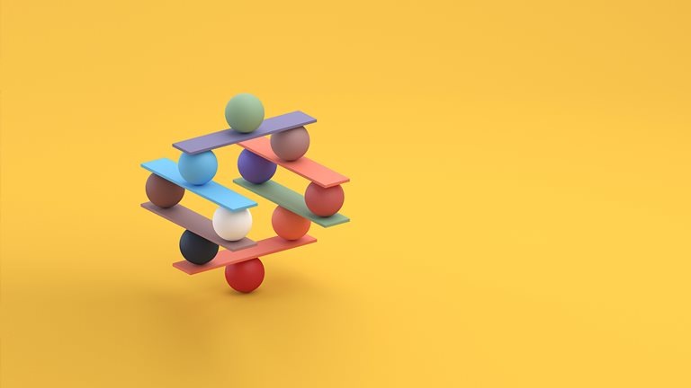 Stock photo of a Jenga game color block tower with balls