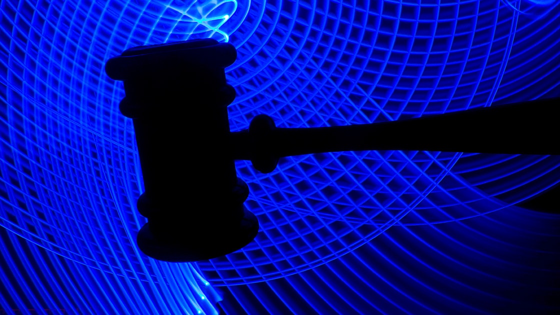 Image of a gavel on a blue background