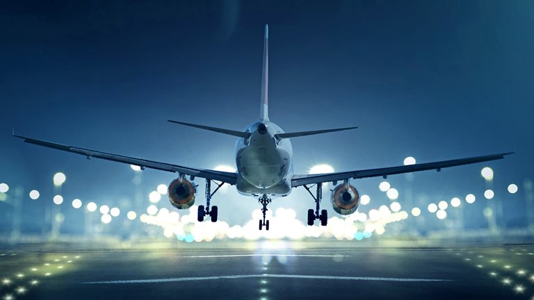 Image of an airplane about to land on a runway