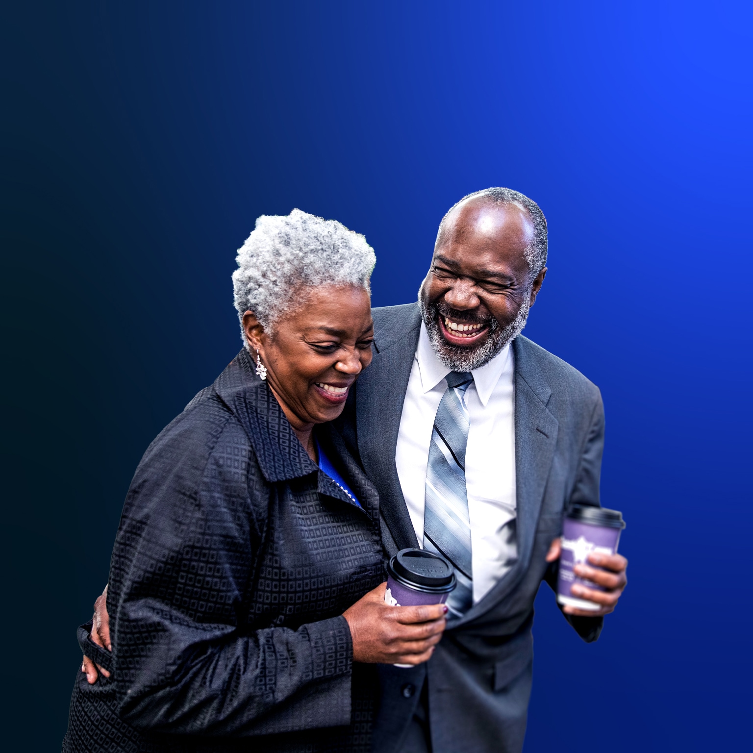 Image of elderly Black man and woman holding hot beverage tumblers