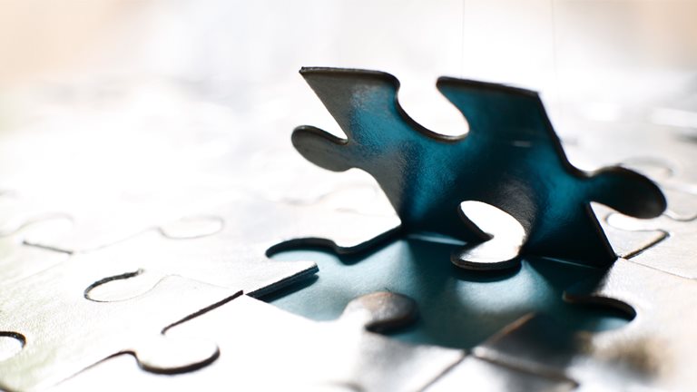 Image of a jigsaw piece backlit photo