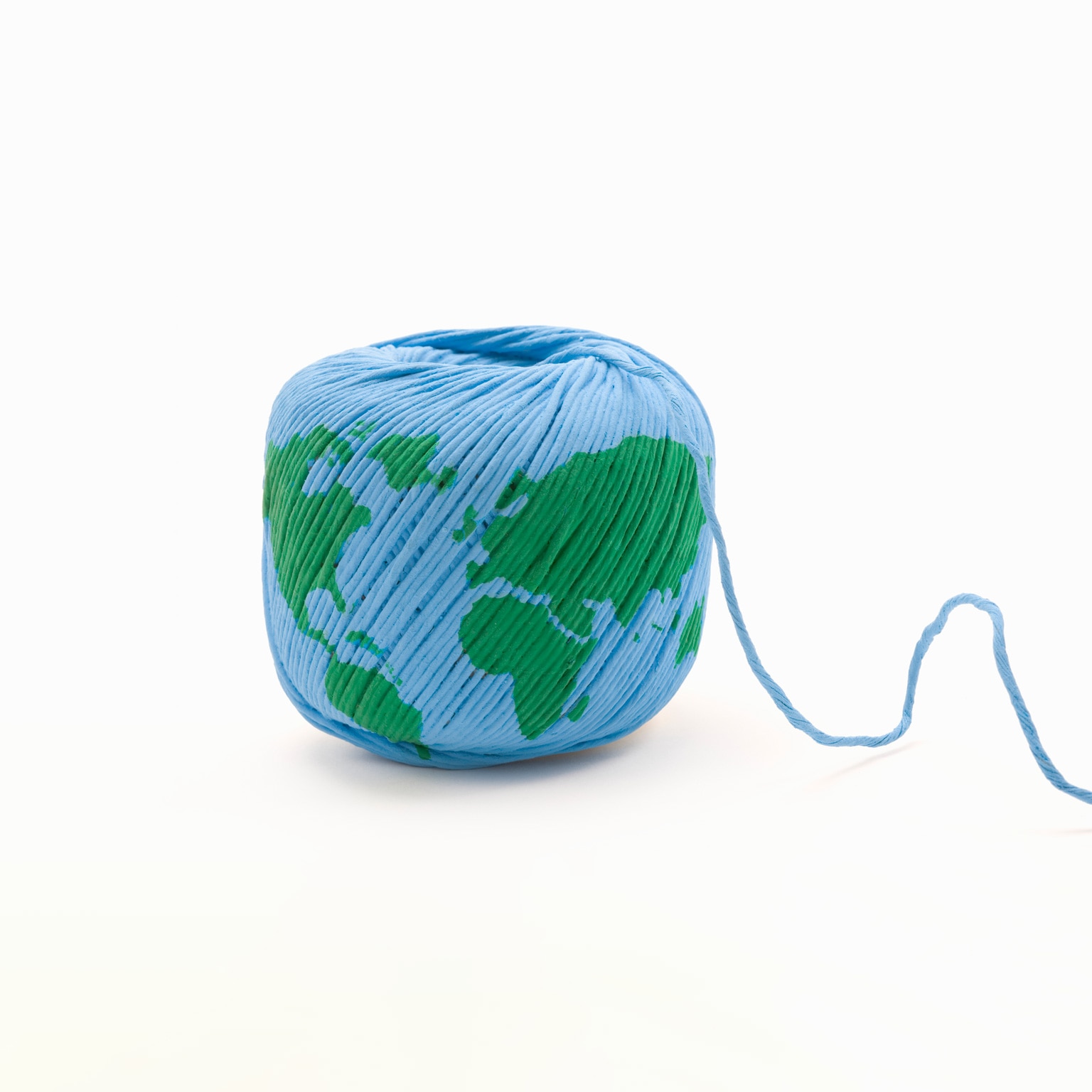 Image of a map of Earth on a ball of yarn