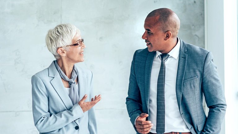 mage of a man and woman talking to each other