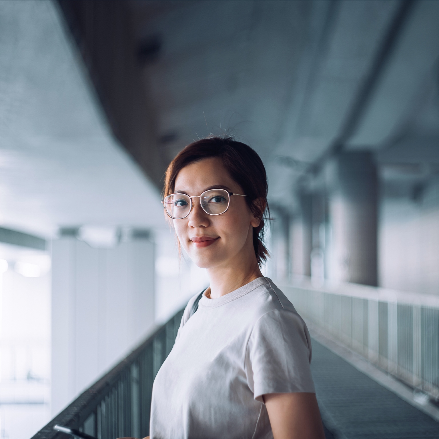 Stock photo of a young Asian woman looking at the camera and smiling