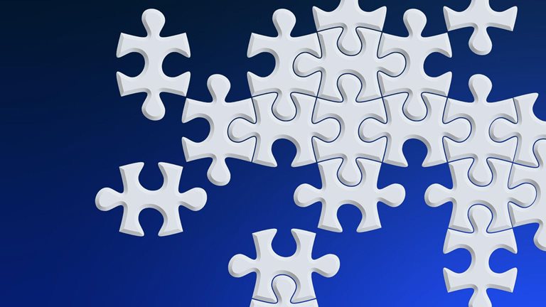 Image of gray puzzle pieces on a blue background