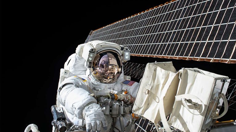 An astronaut at work during a spacewalk. 