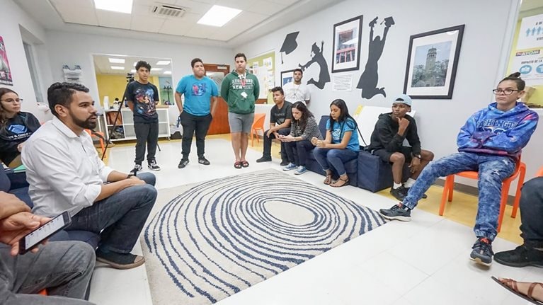 Eduardo Carrera with community members participating in PSI's programs.