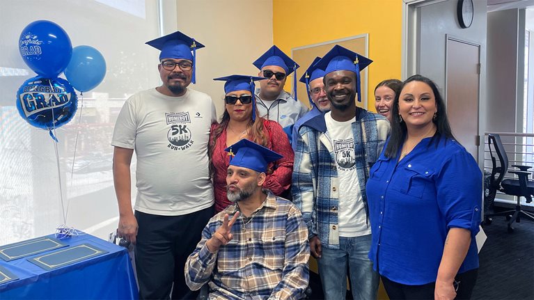 The first cohort of Homeboy's new dog grooming business celebrating their job training completion