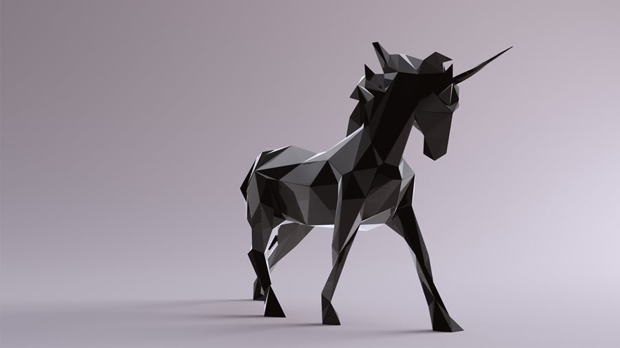 A black origami unicorn stands against a lavender background