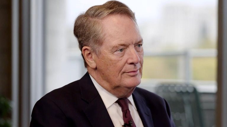 Robert Lighthizer in a suit and tie, seated and looking slightly to his right with a composed, attentive expression.