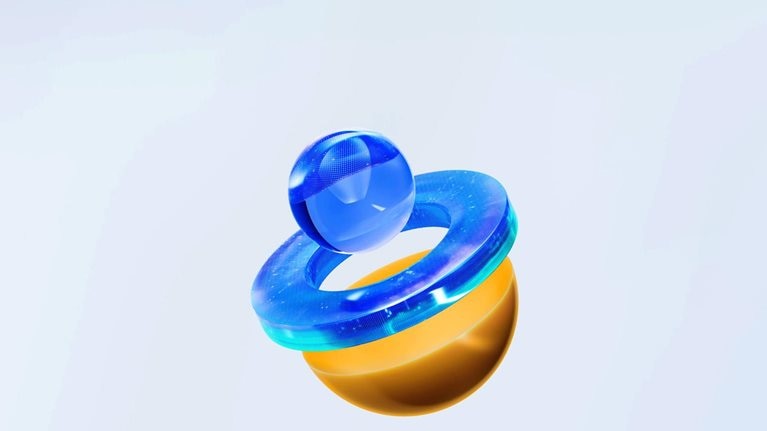 A clear, blue sphere rests above a matching, transparent ring, while an orange half-sphere hovers just below them. It seems as though the shapes have separated and taken on their own distinct forms.