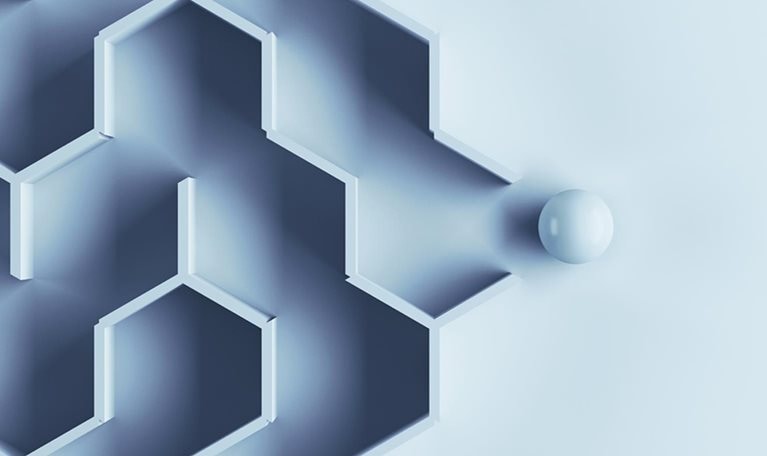 Hexagonal labyrinth with single ball escaping the maze.