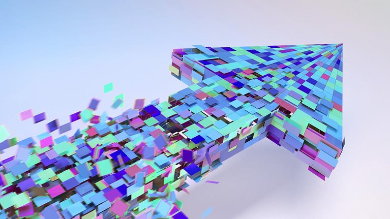 Lots of multi-colored square coming together to form a three dimensional arrow. The squares are forming in the wake of the arrow head and are moving quickly with motion blur.