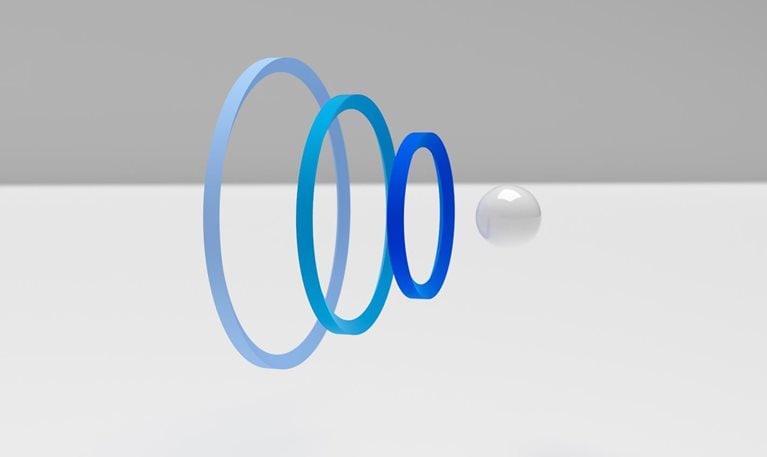 digital rendering of a sphere going through layers of Intertwined rings