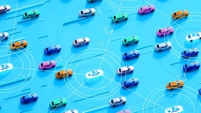A bird's-eye view of numerous cars arranged on a bright blue background. Some cars are interconnected by a network of glowing lines.