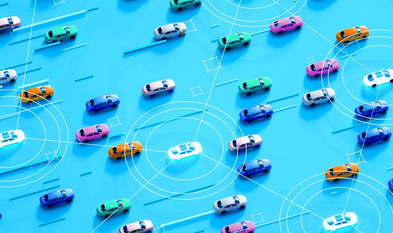 A bird's-eye view of numerous cars arranged on a bright blue background. Some cars are interconnected by a network of glowing lines.