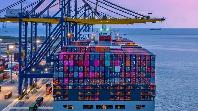 Container ship in seaport at night