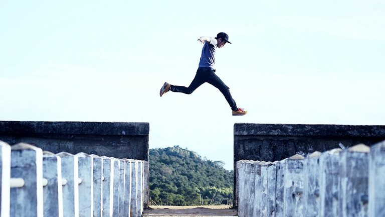 Man Jumping Against Sky