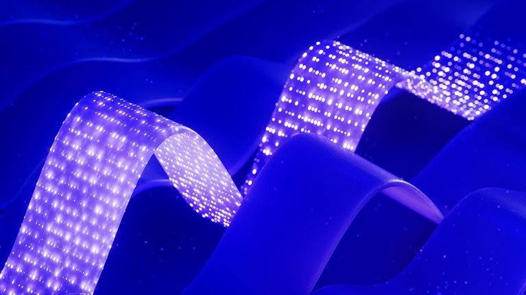 Abstract blue waves with two glowing dotted ribbons creating a futuristic, digital effect.