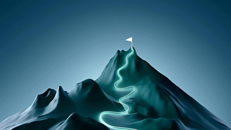 A stylized mountain with a white flag planted at its peak. A winding, glowing path leads to the summit.