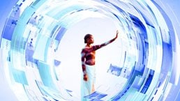 A woman stands at the center of a glowing, circular digital interface composed of layered blue and white translucent panels. She reaches out with her hand to touch the futuristic data displays that surround her in a dynamic, swirling formation.