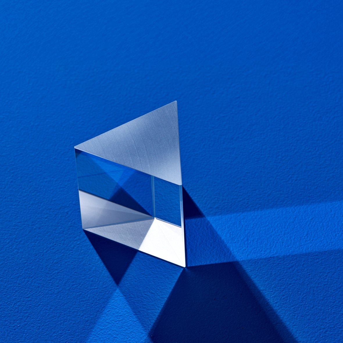 Triangular prism refracting light beam