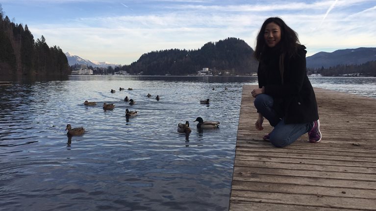 Jo on dock with ducks in Japan
