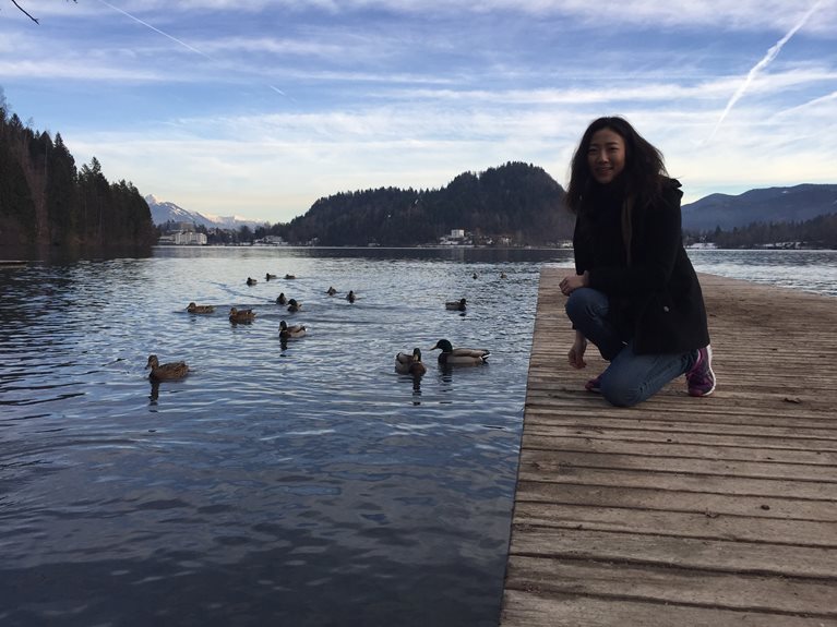 Jo on dock with ducks in Japan
