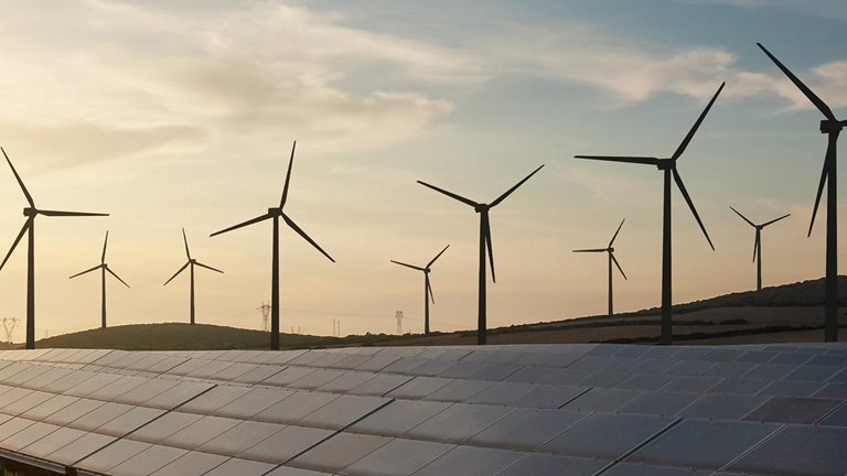 Solar and wind energy farm - stock photo