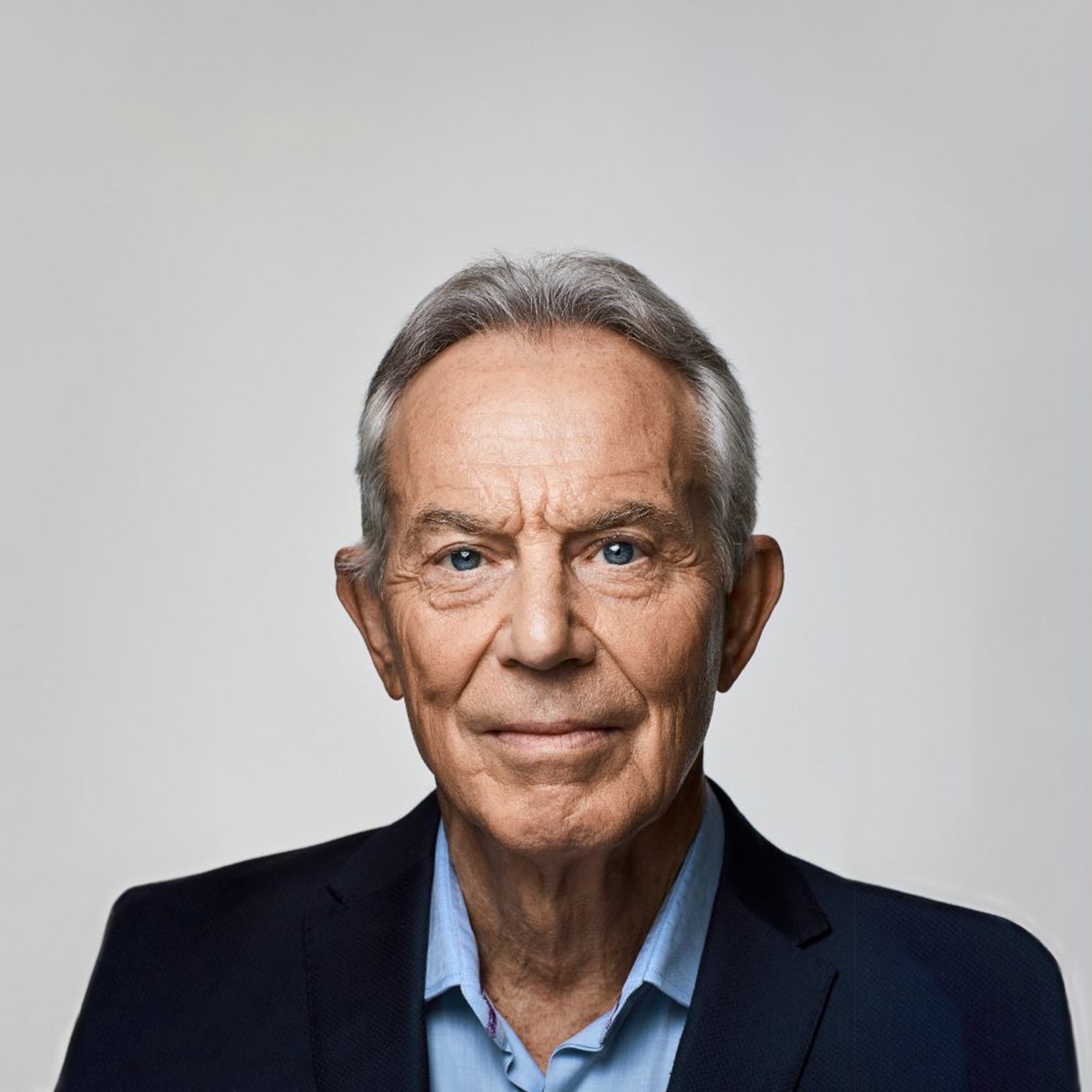  Close-in portrait of Tony Blair with a direct, steady gaze.