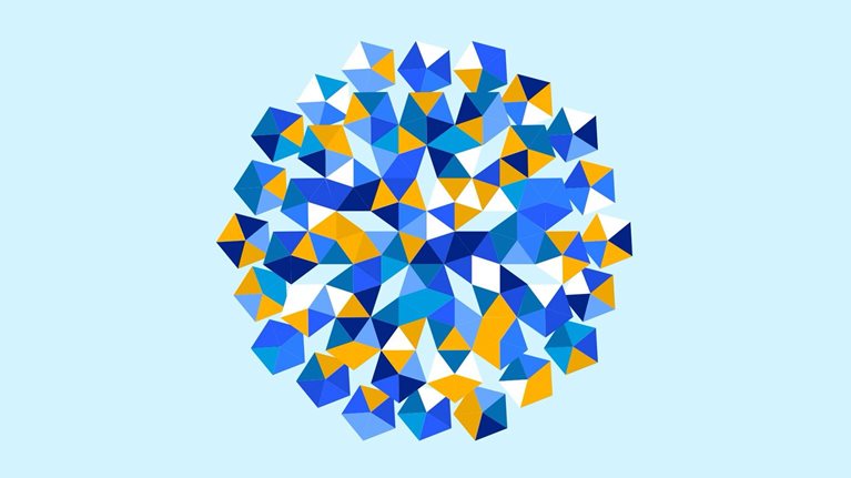 An animated pentagon shaped mosaic sits against a pale blue background. It is made of smaller blue, white, and orange triangular facets that rotate to reveal shifting patterns.
