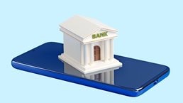 A stylized miniature bank building with the word "BANK" on its facade sits on top of a blue smartphone.