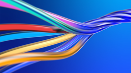 A close up of a colorful strands of ropes knotting together into one