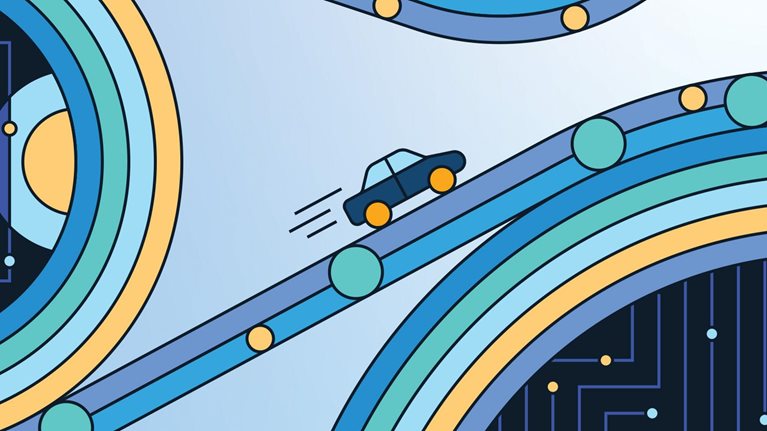 A small, fast car speeds up the road, having just navigated a series of geometric loops.