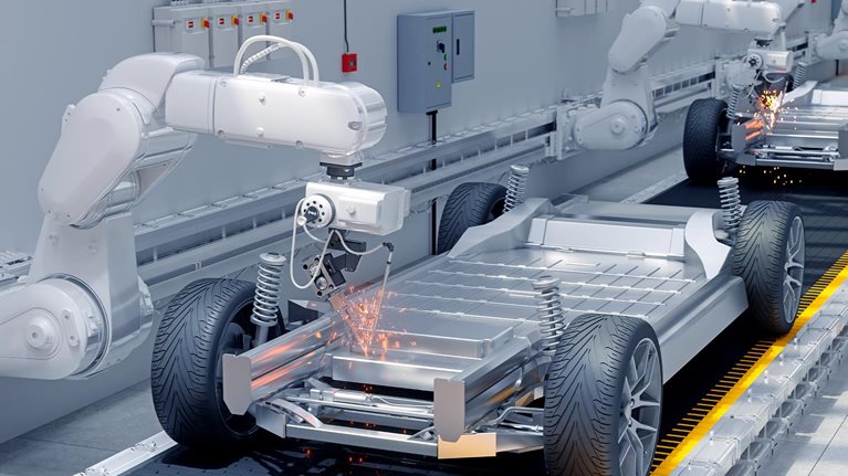 Close-up View Of Robot Arms Assembling Cars In Car Factory