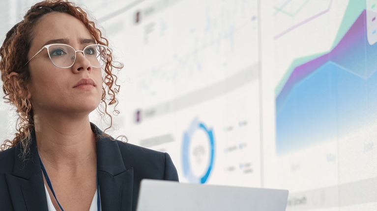 Image of woman reviewing presentation with charts
