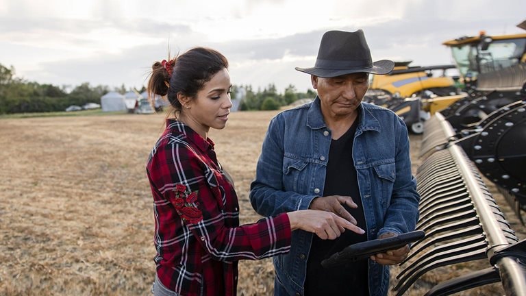 mage of a woman and a man working on a farm