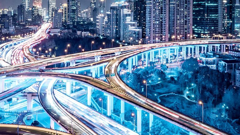 Busy interconnected highways at different levels against sky-scrapers in China