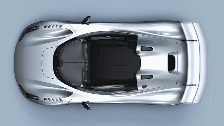 Overhead view of luxury car on display over still background