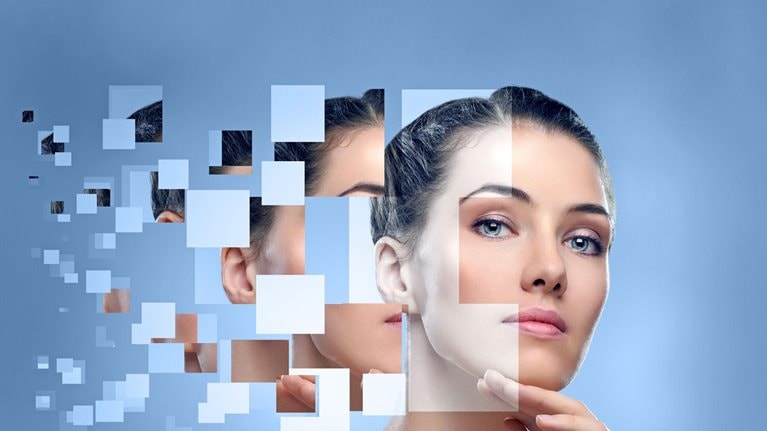 Pixelated beauty portrait of a woman on a pale blue background.